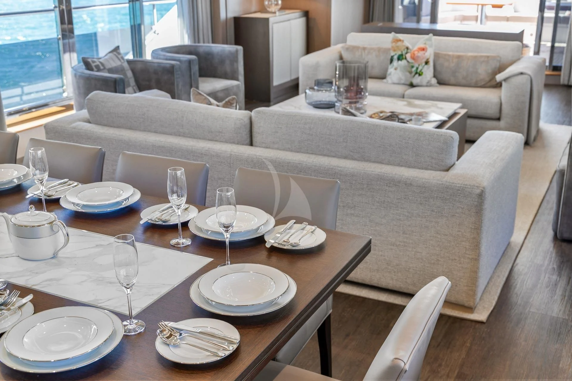 a table with plates and glasses on it aboard SUNSET Yacht for Sale
