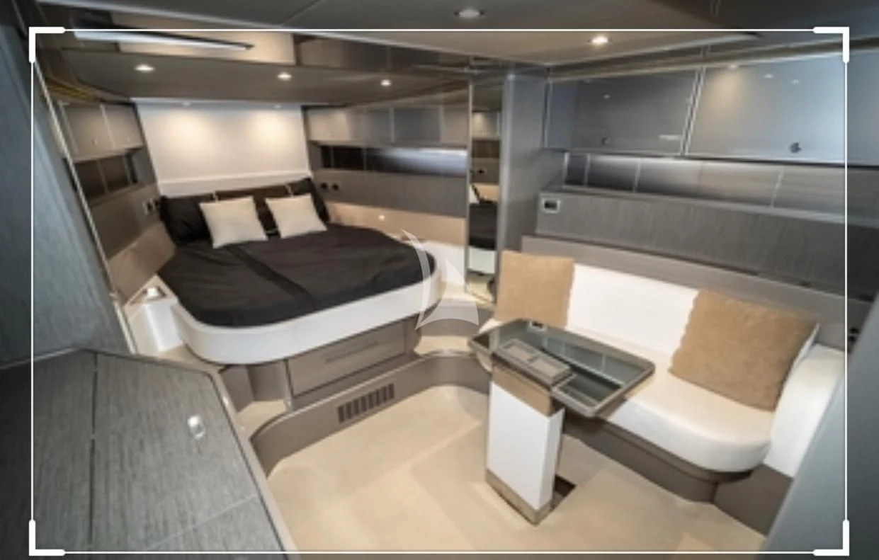 a room with a bed and a desk aboard PEGASUS Yacht for Charter