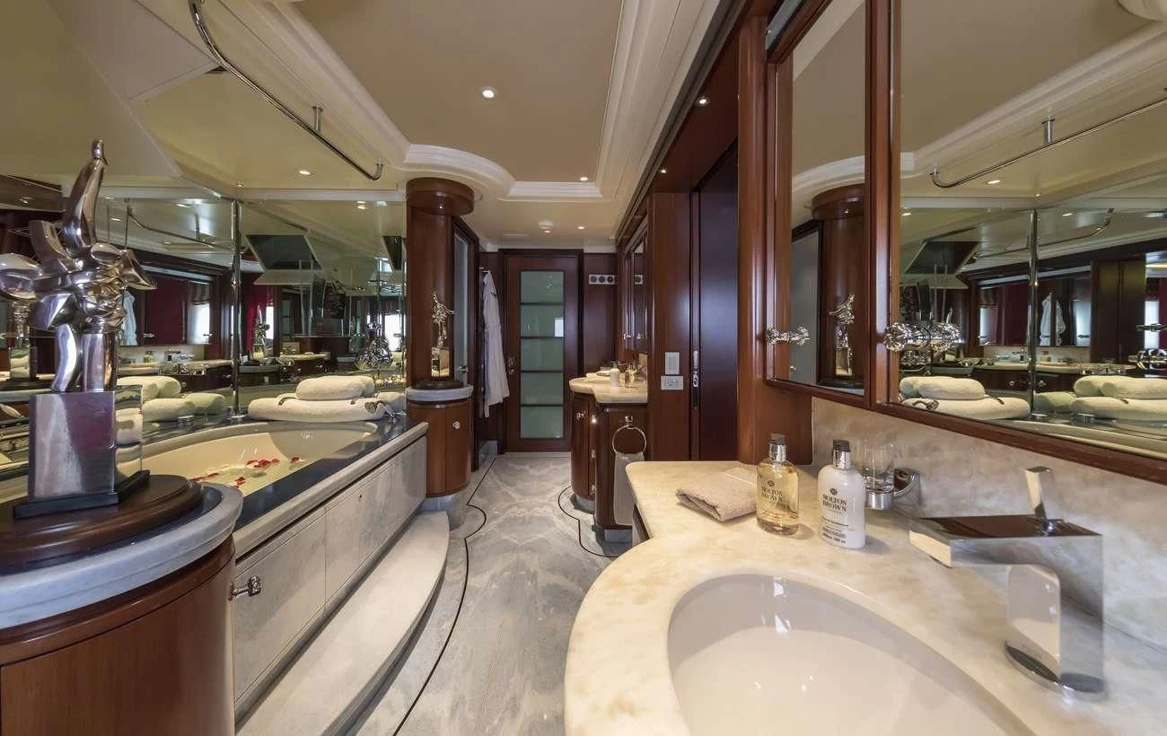 a large bathroom with a large mirror aboard PEGASUS Yacht for Charter