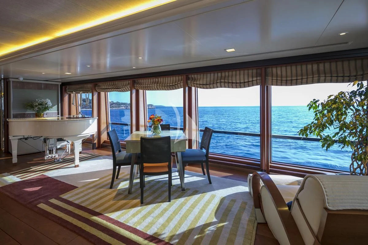 a room with a table and chairs aboard PEGASUS Yacht for Charter