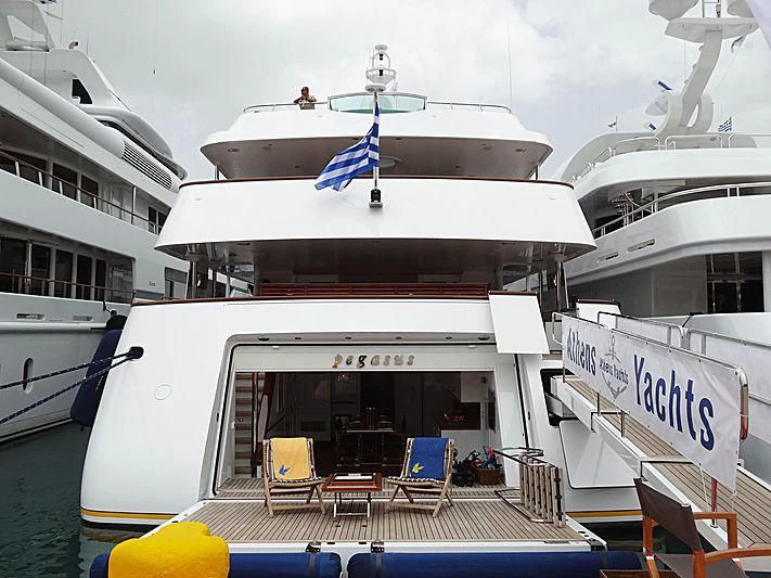a boat docked at a pier aboard PEGASUS Yacht for Charter