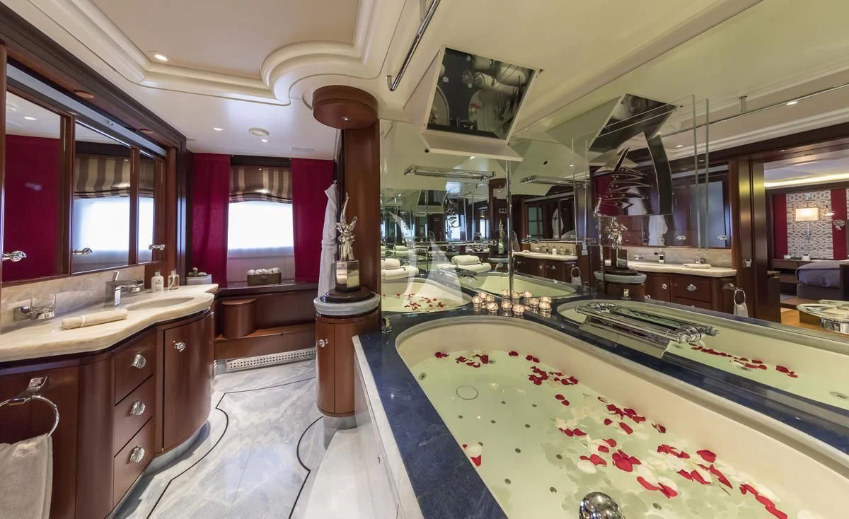 a bathroom with a tub sink and a sink aboard PEGASUS Yacht for Charter