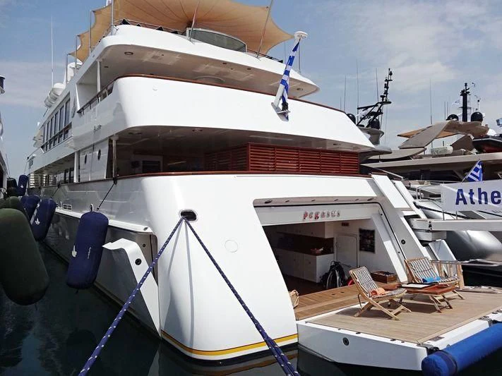 a boat docked at a pier aboard PEGASUS Yacht for Charter