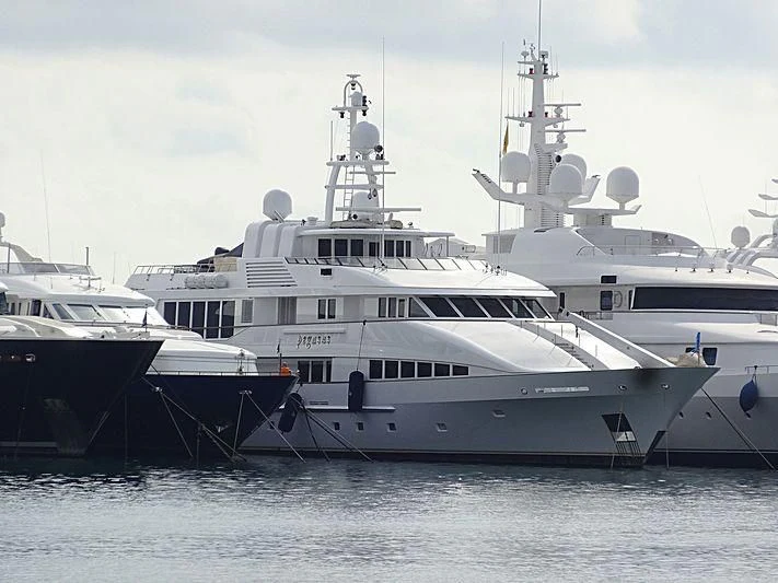 a large white boat with a smaller boat in it aboard PEGASUS Yacht for Charter