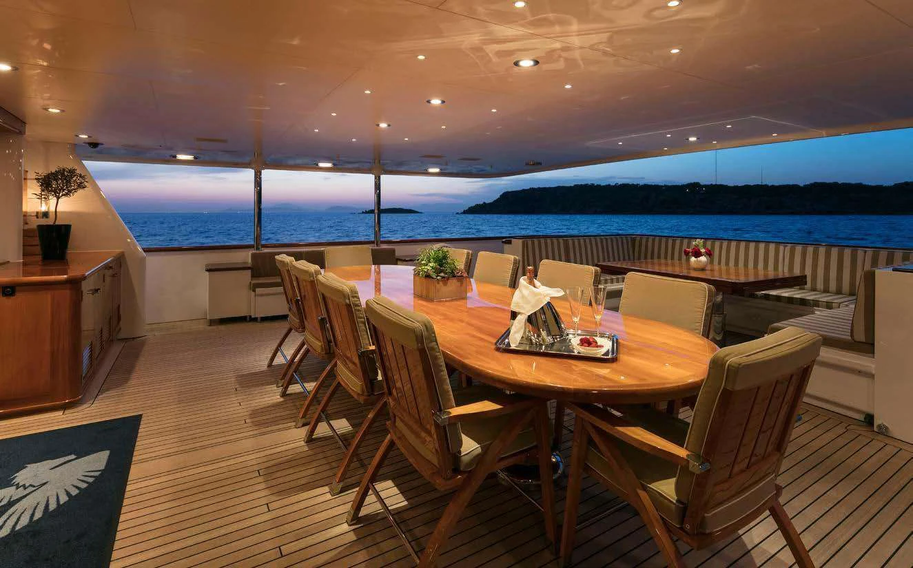 a room with a table and chairs aboard PEGASUS Yacht for Charter
