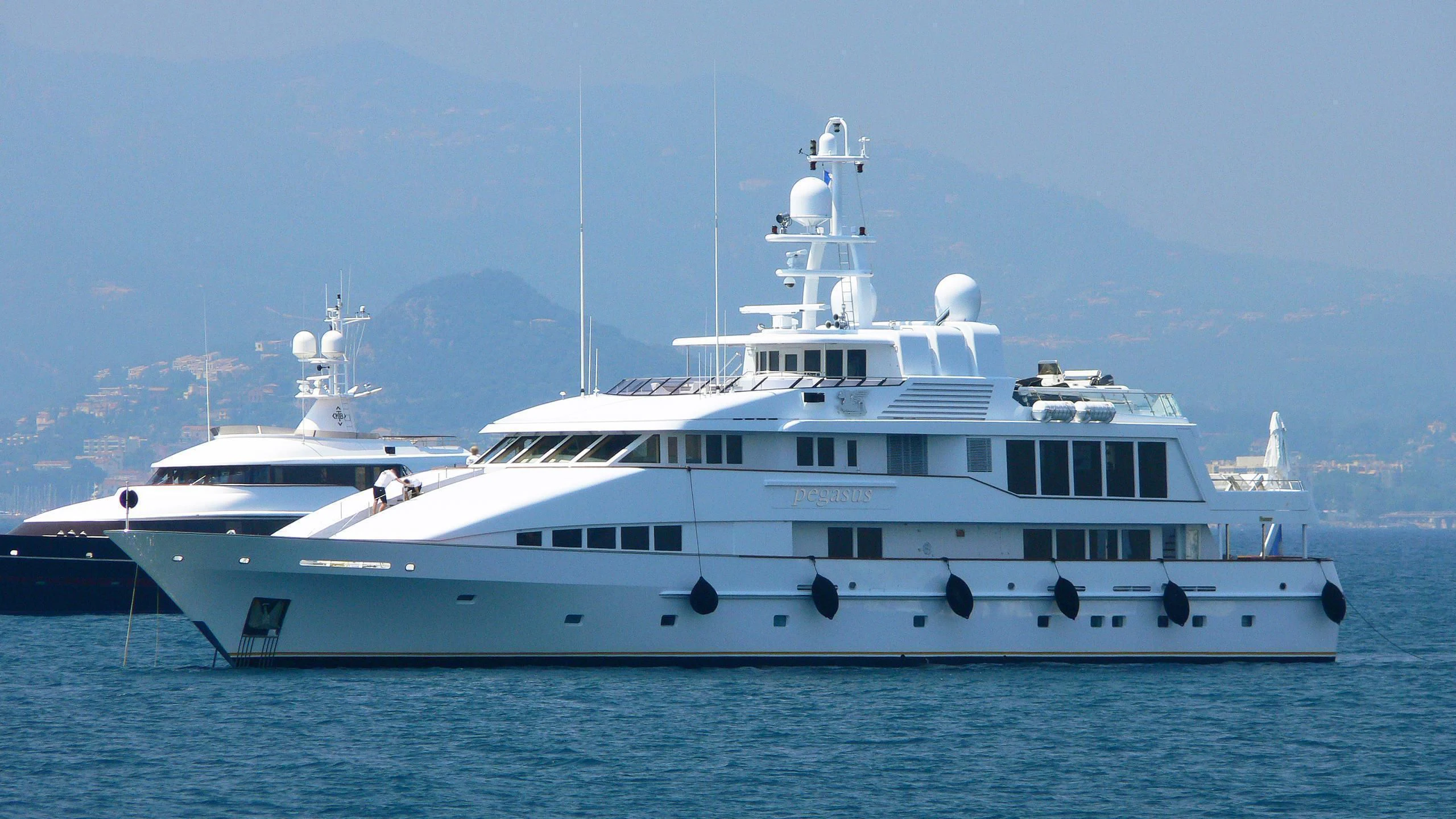 a large white boat in the water aboard PEGASUS Yacht for Charter