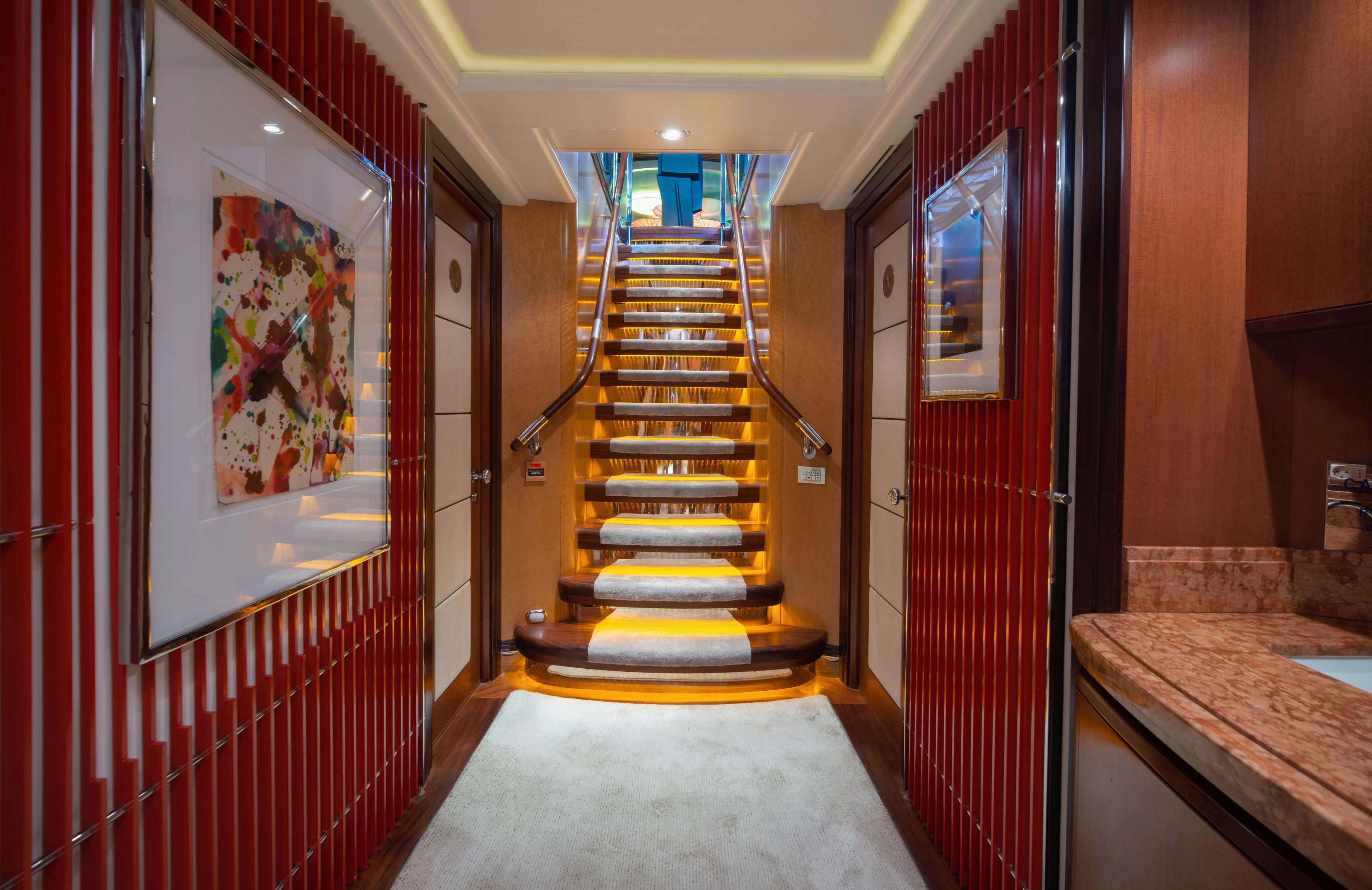 a hallway with a set of stairs aboard PEGASUS Yacht for Charter
