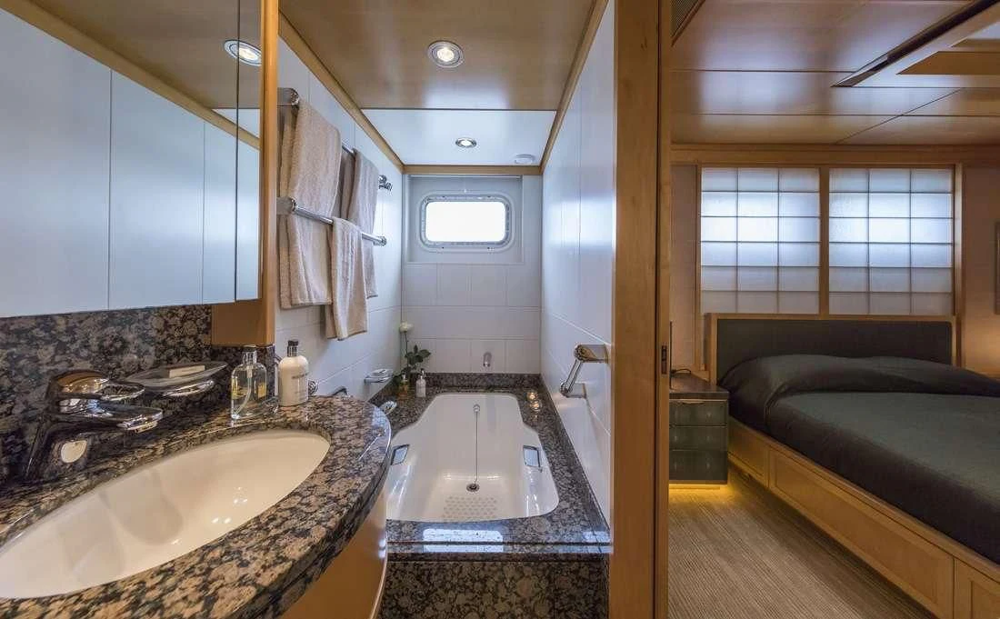 a bathroom with a sink and a bathtub aboard PEGASUS Yacht for Charter