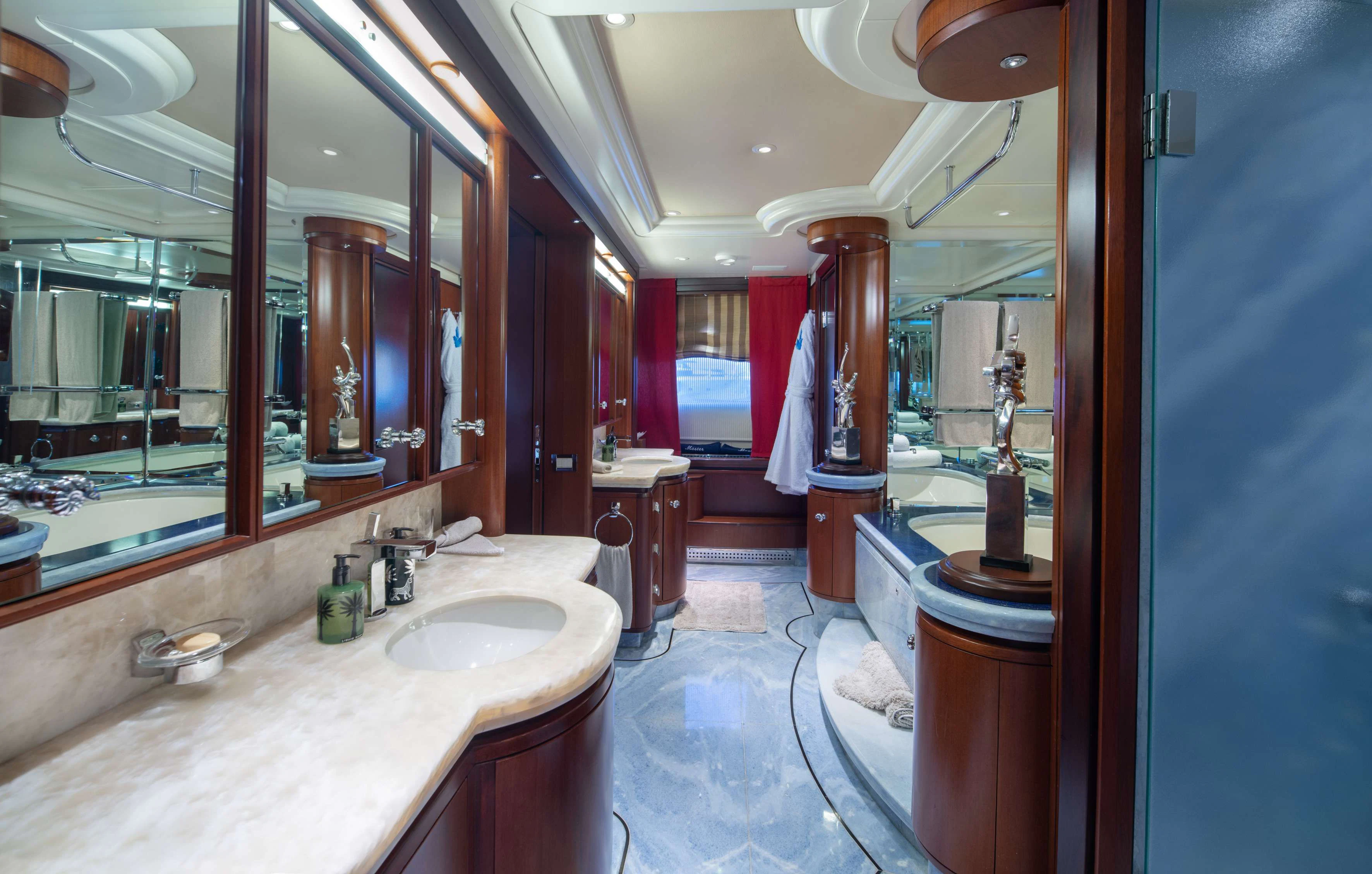 a bathroom with a large mirror aboard PEGASUS Yacht for Charter