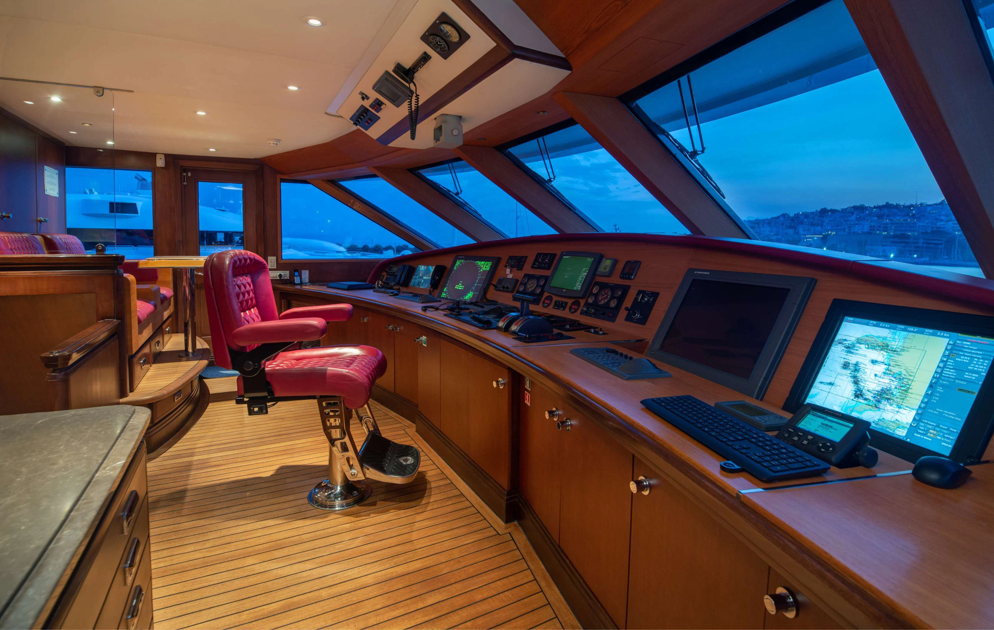 a room with computers and monitors aboard PEGASUS Yacht for Charter