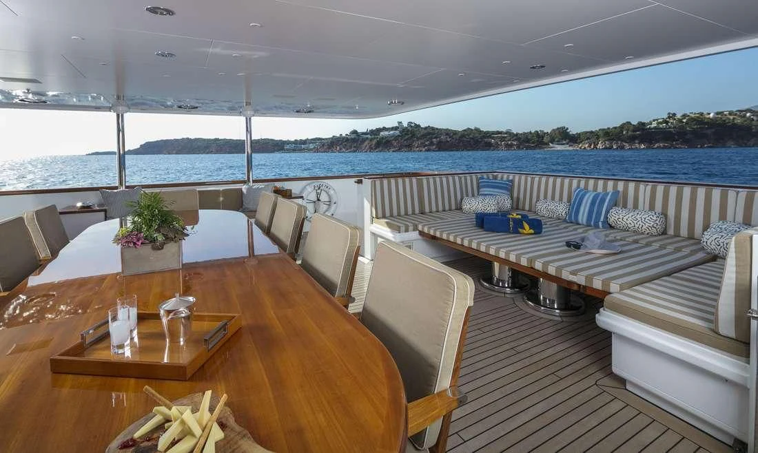 a room with a table and chairs aboard PEGASUS Yacht for Charter