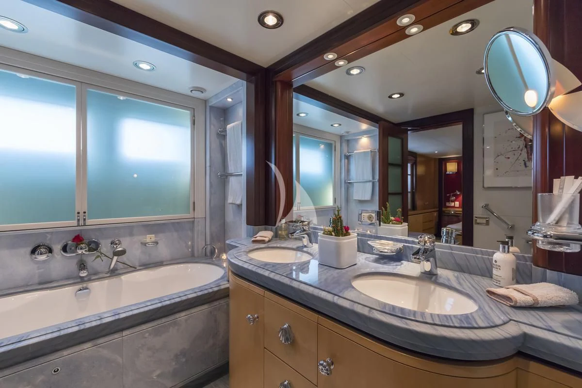 a bathroom with a large mirror aboard PEGASUS Yacht for Charter