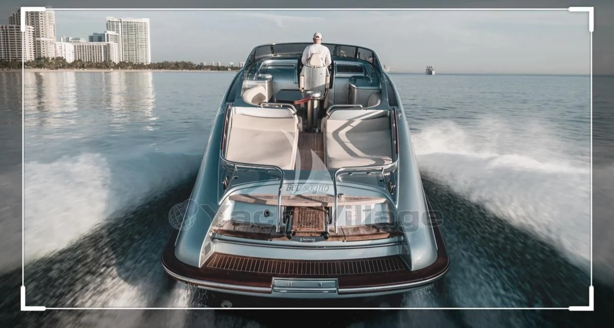 a person standing on the front of a boat on the water aboard PEGASUS Yacht for Charter