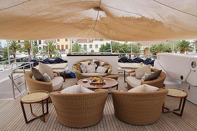 a patio with chairs and tables aboard PEGASUS Yacht for Charter