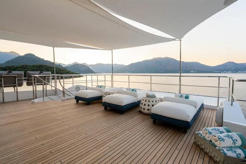 a deck with a couple of beds on it aboard ELIZABETH Yacht for Sale