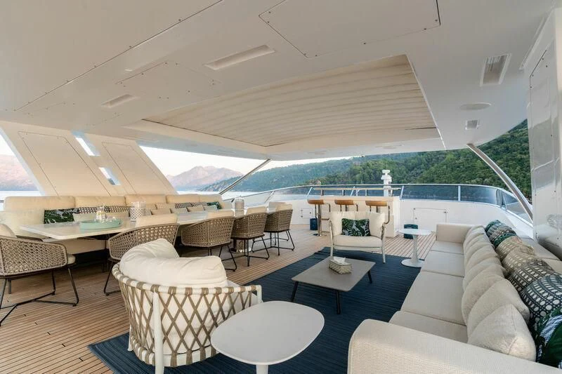 a room with a couch and a table and chairs aboard ELIZABETH Yacht for Sale