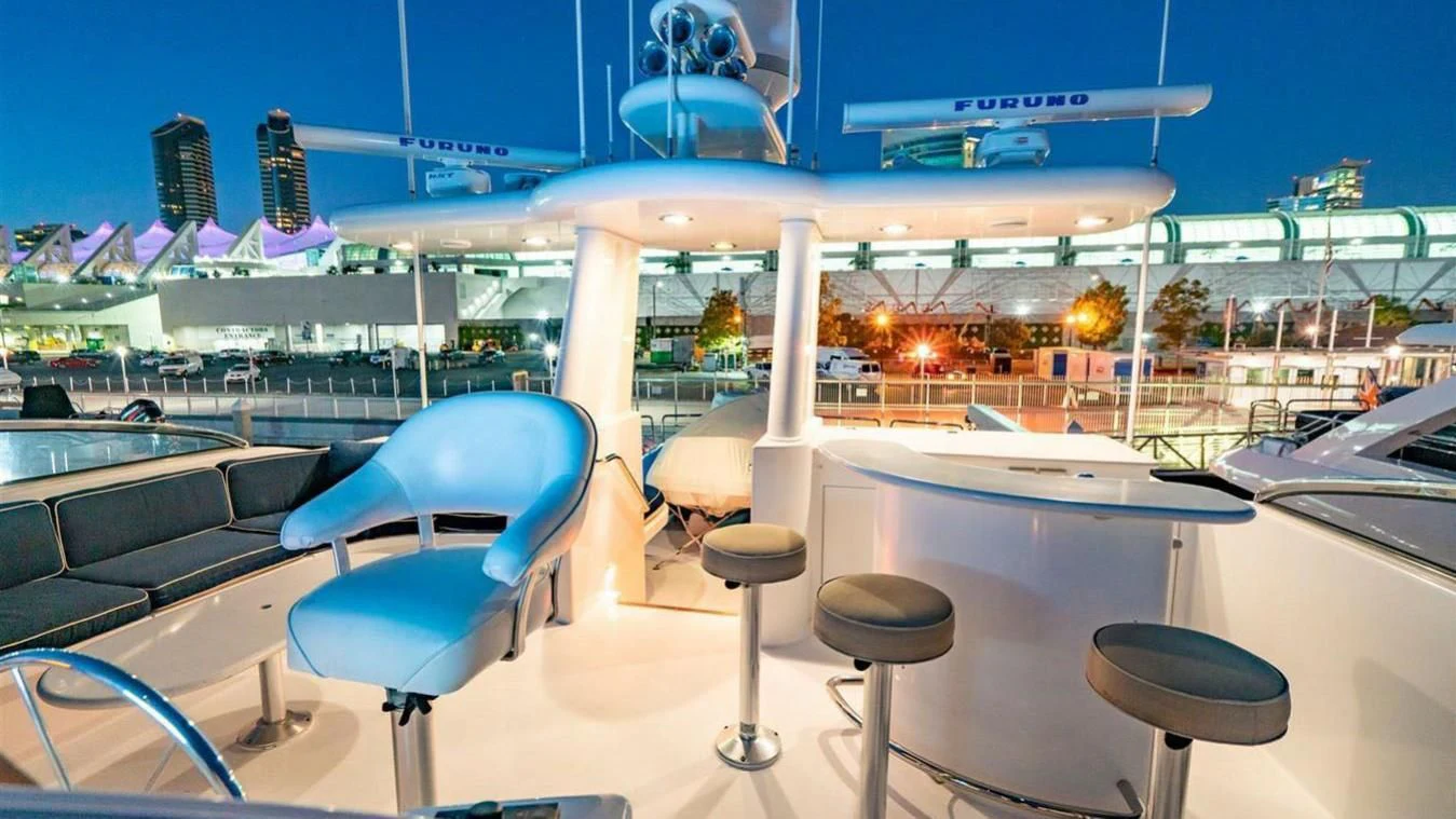 a room with chairs and a table aboard SNOWBORED Yacht for Sale