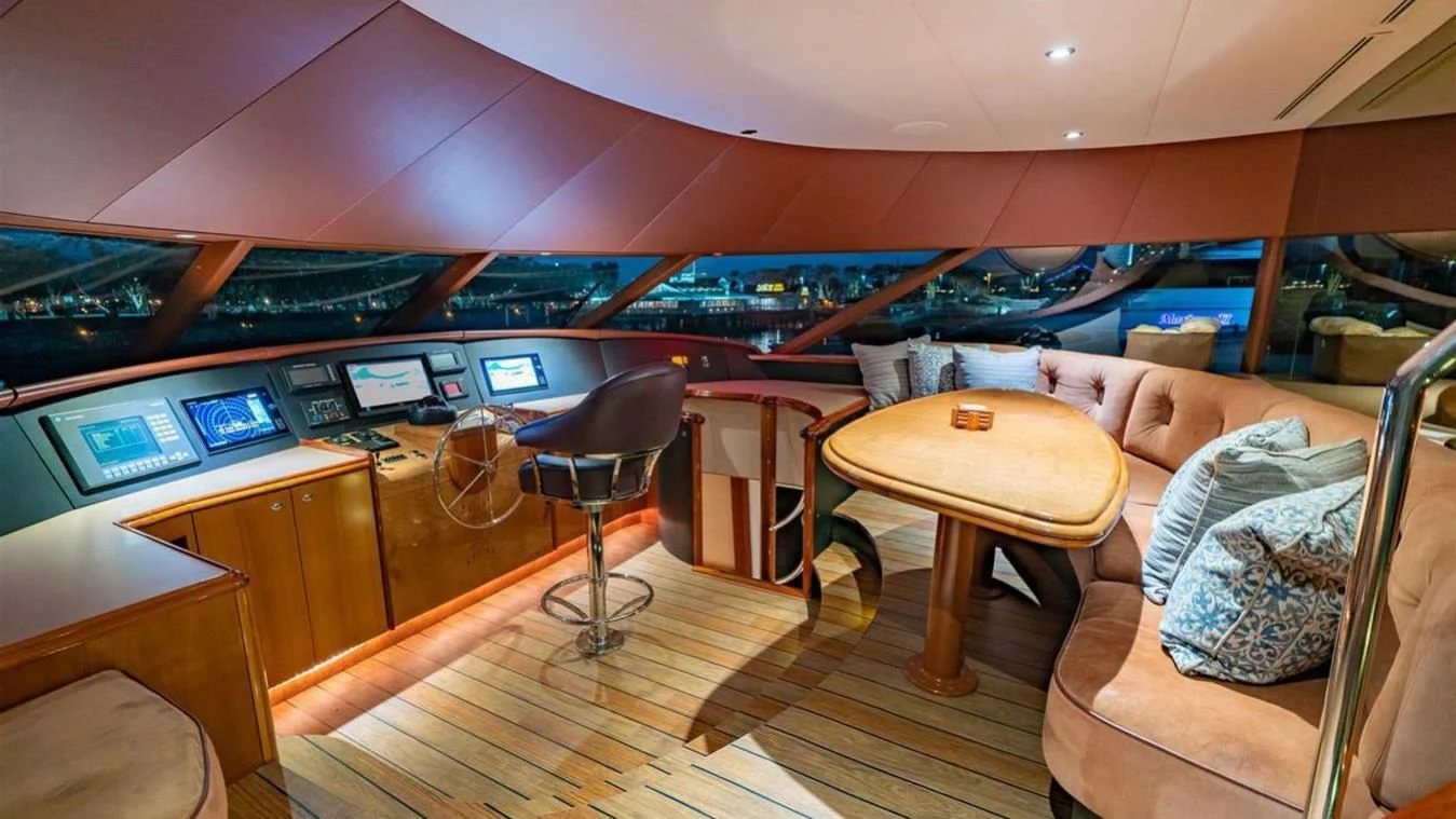a room with a couch and a table and chairs aboard SNOWBORED Yacht for Sale