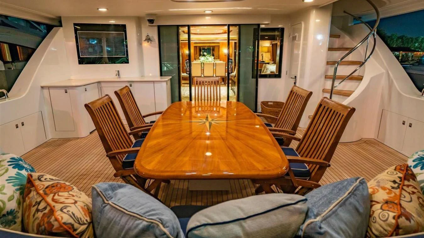 a dining table in a living room aboard SNOWBORED Yacht for Sale