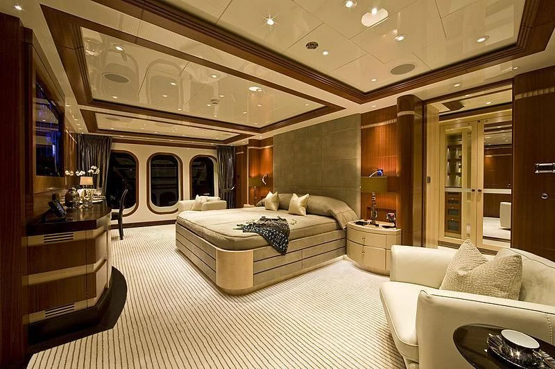 a large bedroom with a bed aboard RARE FIND Yacht for Charter