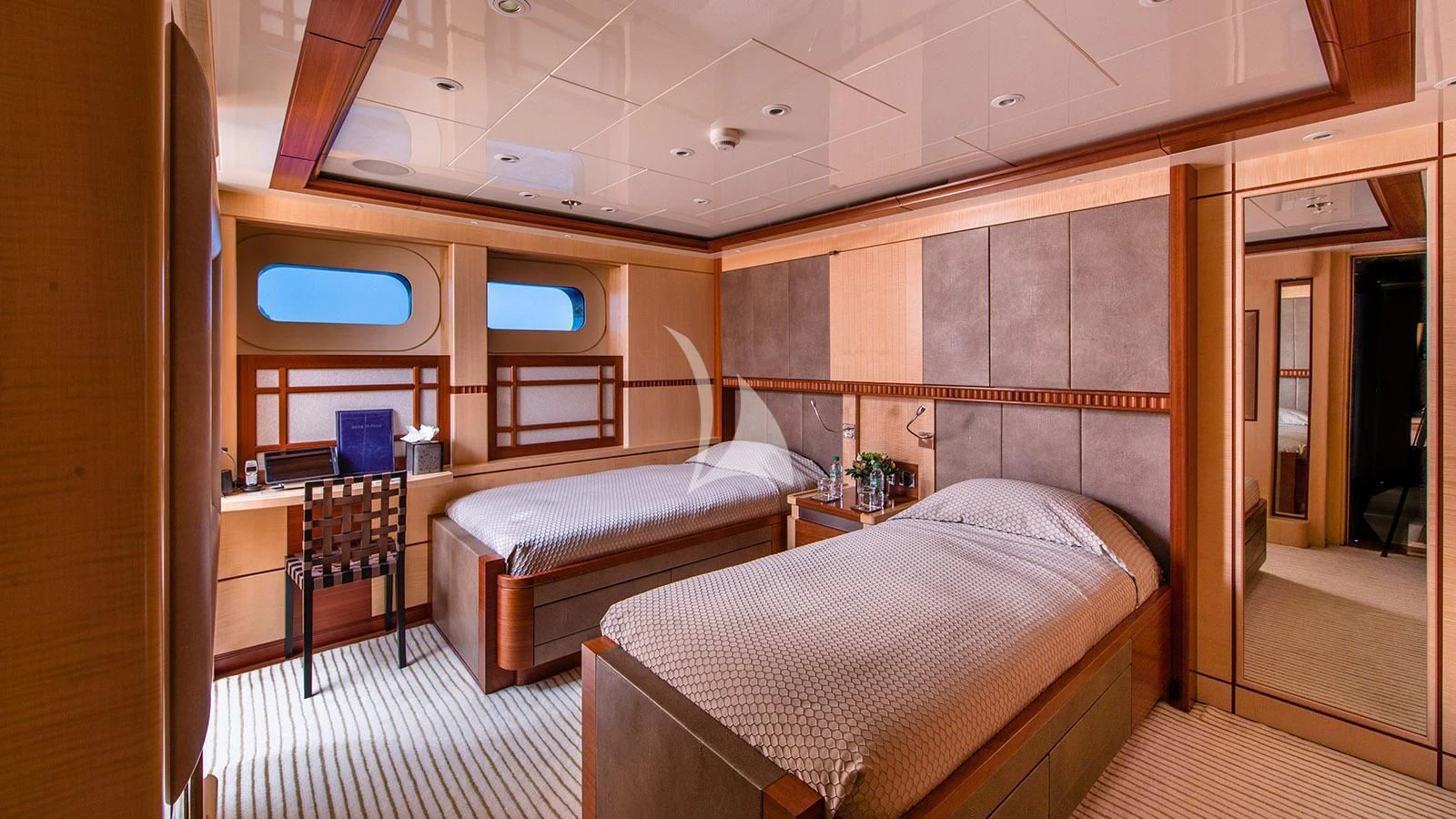 a room with two beds aboard RARE FIND Yacht for Charter