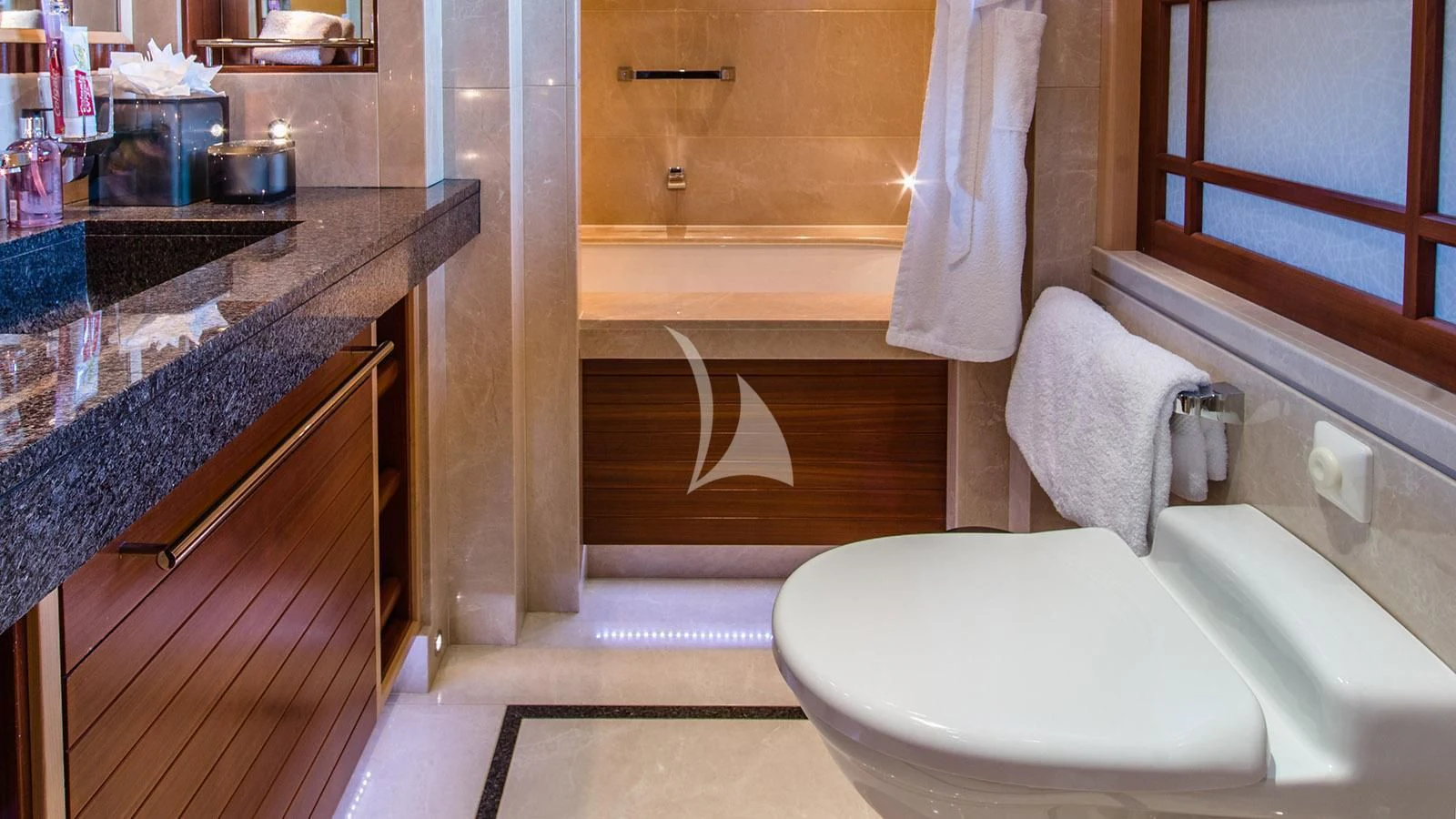 a bathroom with a toilet and a sink aboard RARE FIND Yacht for Charter