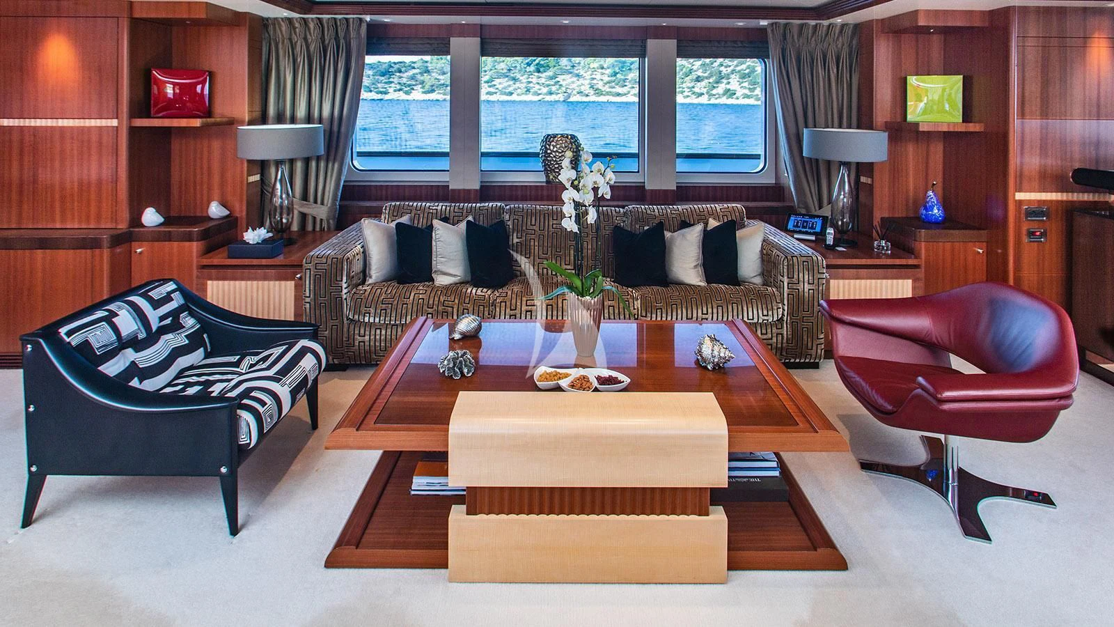 a living room with a couch and a coffee table aboard RARE FIND Yacht for Charter