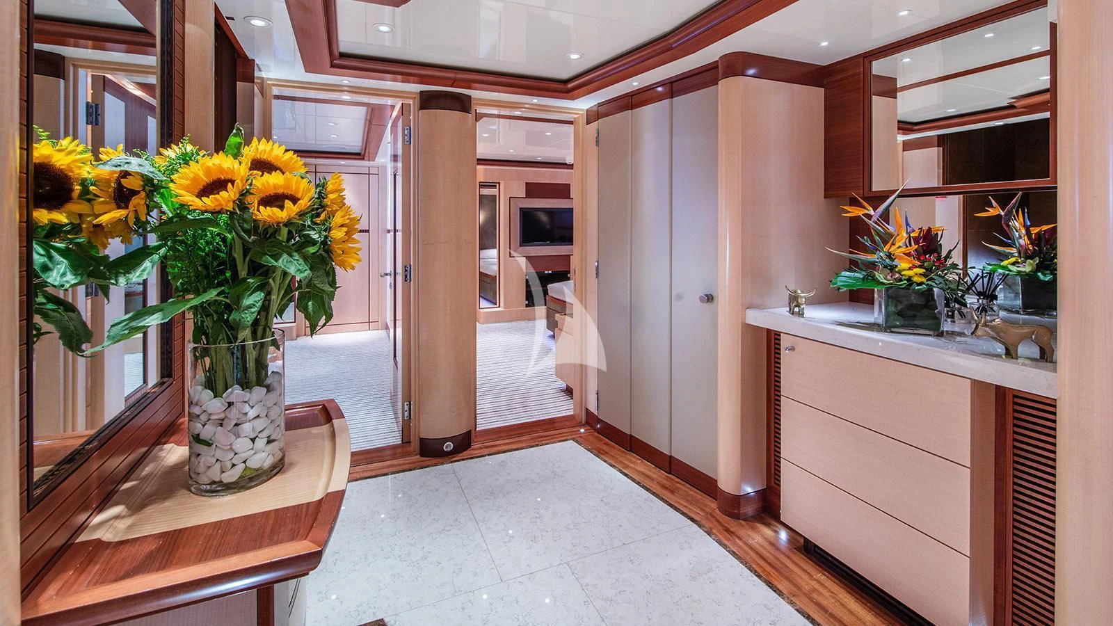 a vase of yellow flowers on a counter in a kitchen aboard RARE FIND Yacht for Charter