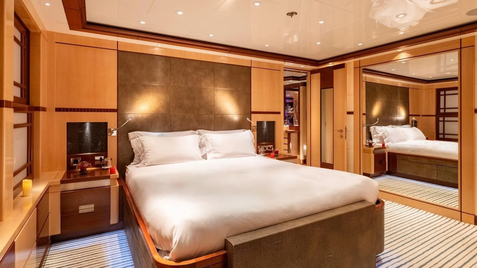 a large bedroom with a large bed aboard RARE FIND Yacht for Charter