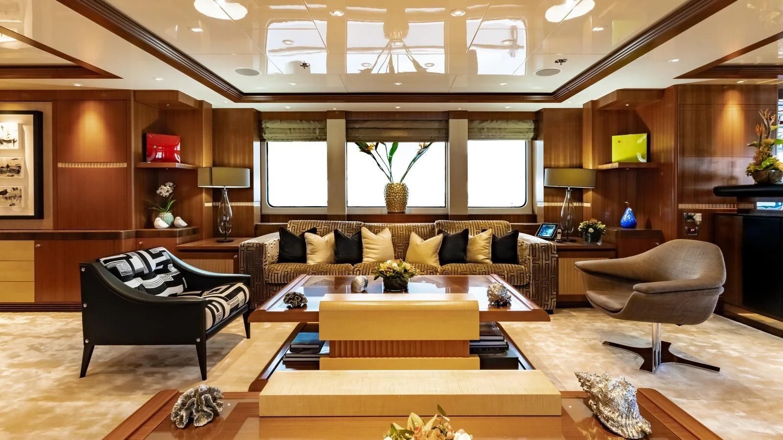 a living room with a couch and a coffee table aboard RARE FIND Yacht for Charter