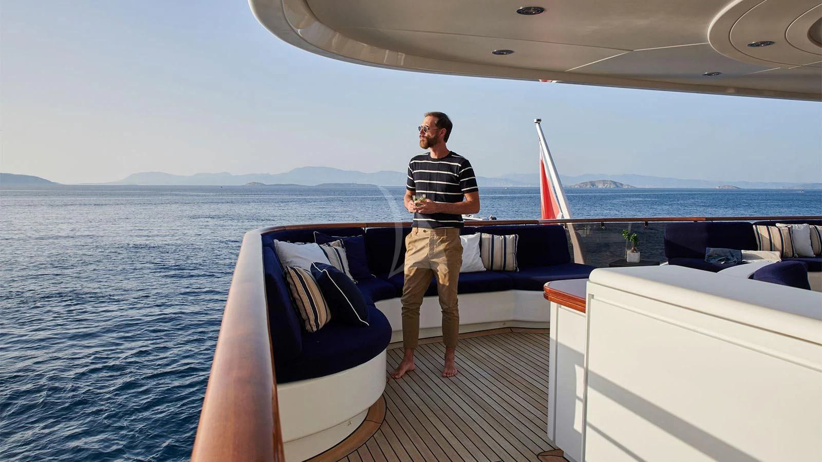 a man standing on a boat aboard RARE FIND Yacht for Charter