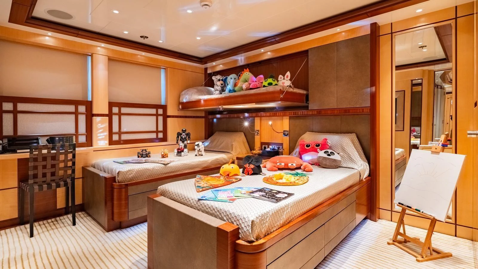a room with a bed and a table aboard RARE FIND Yacht for Charter