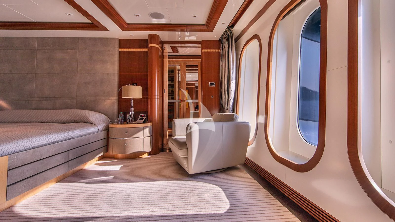 a room with a bed and a mirror aboard RARE FIND Yacht for Charter