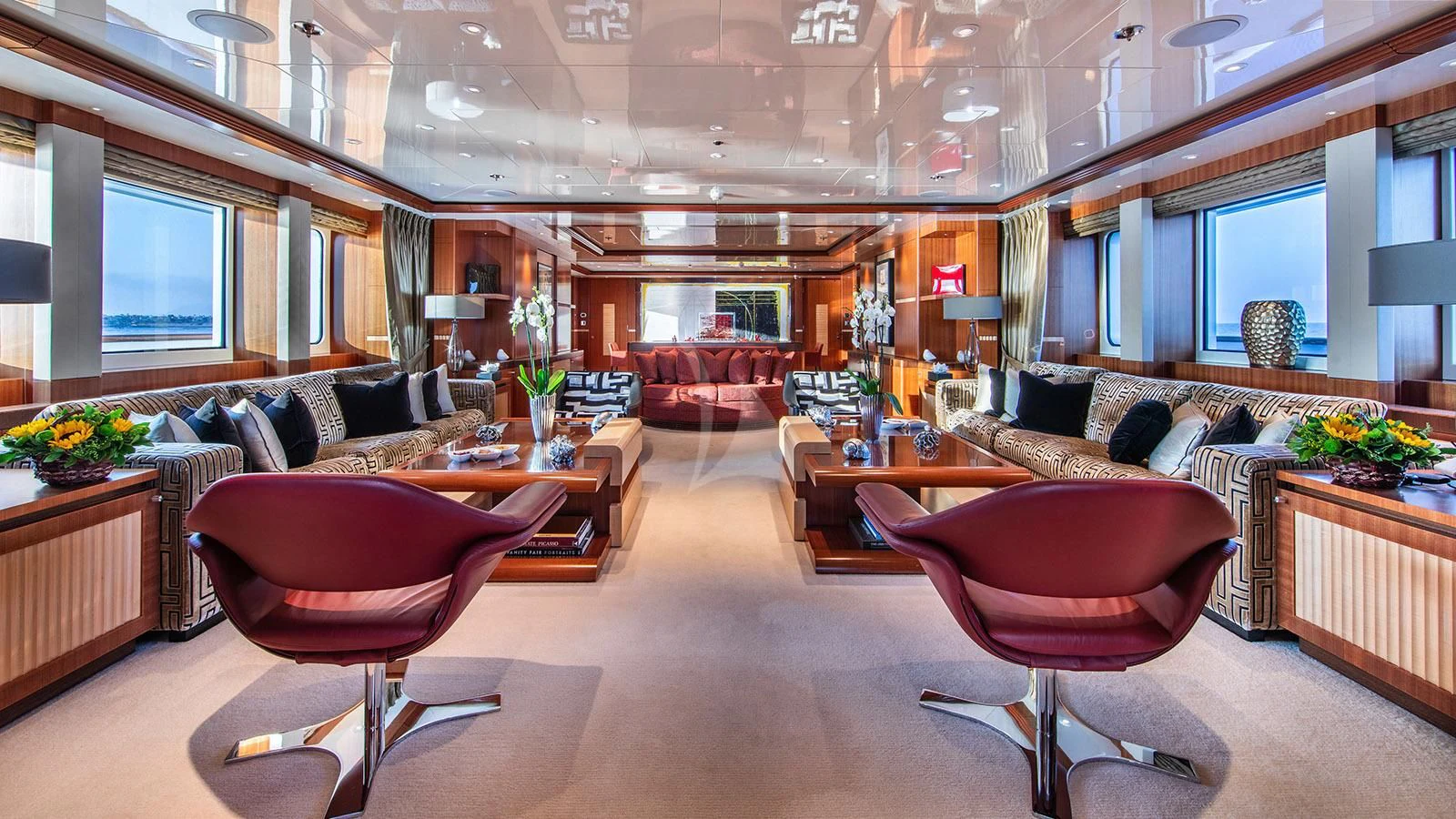 a living room with a couch and a coffee table aboard RARE FIND Yacht for Charter