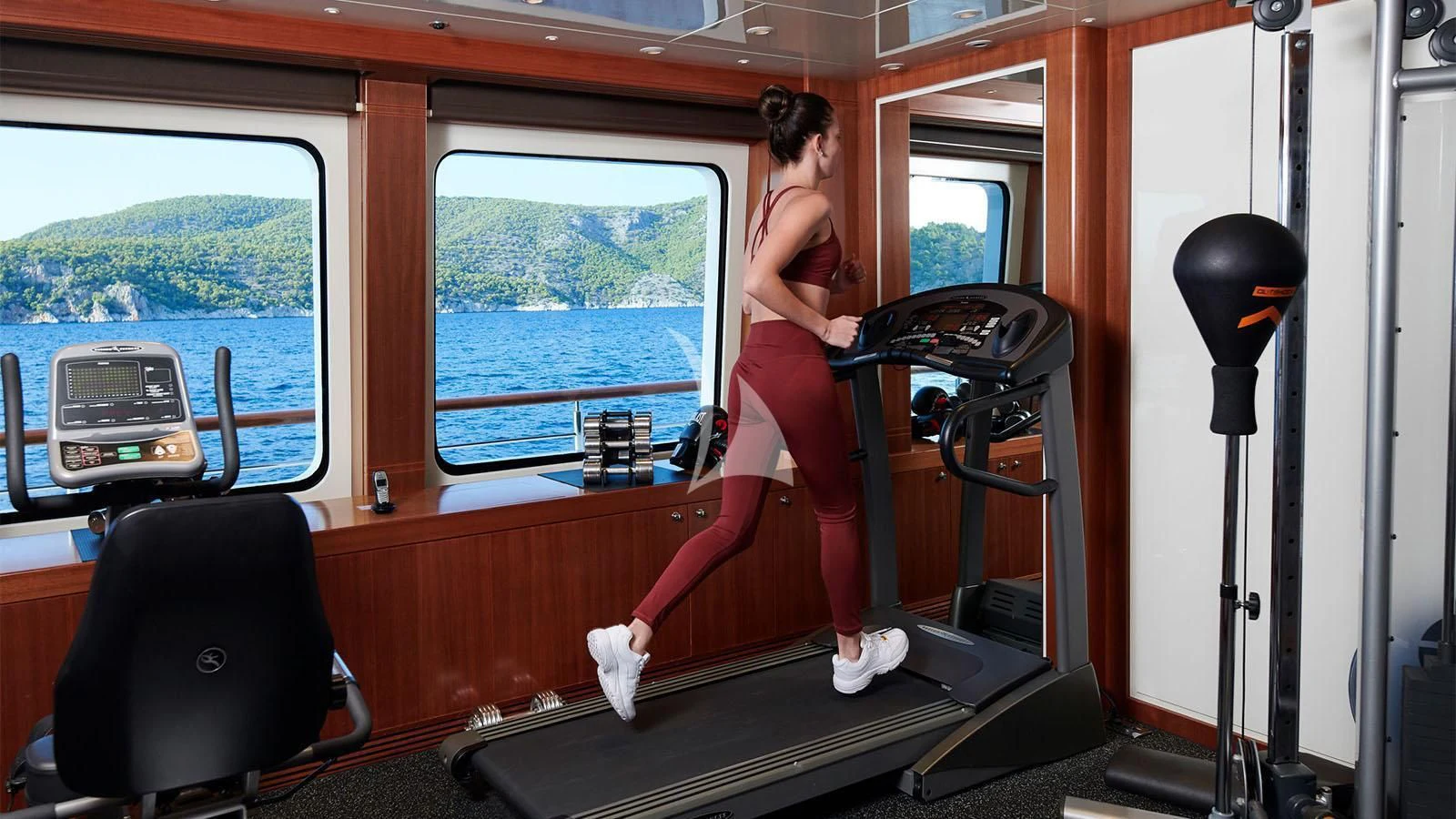 a person sitting on a bench aboard RARE FIND Yacht for Charter