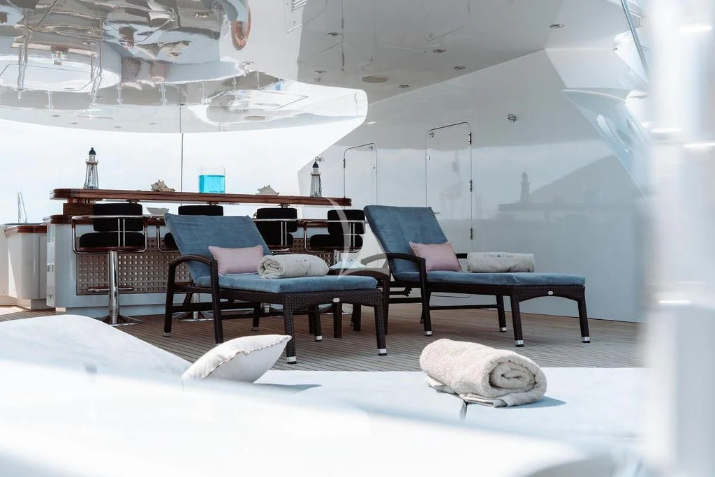 a room with a bed and a couch aboard RARE FIND Yacht for Charter