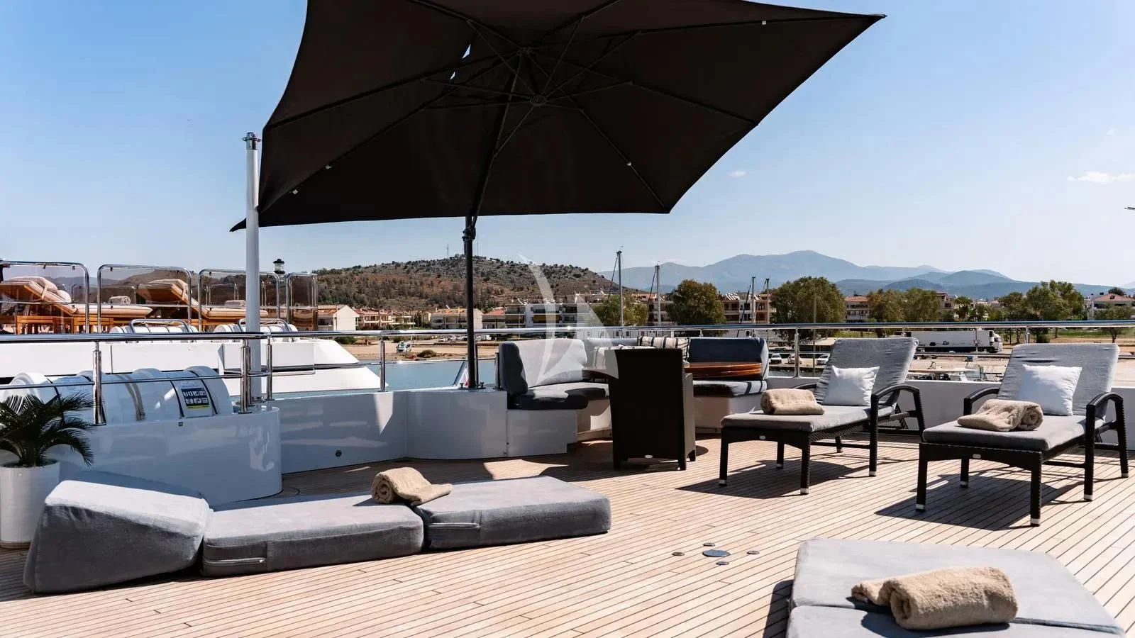 a patio with a large umbrella aboard RARE FIND Yacht for Charter