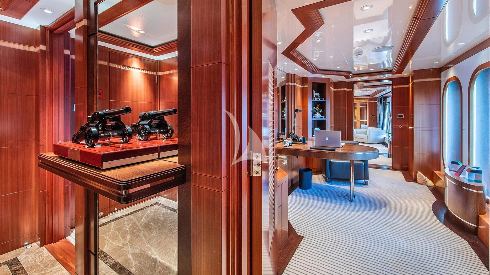 a room with a desk and a computer aboard RARE FIND Yacht for Charter
