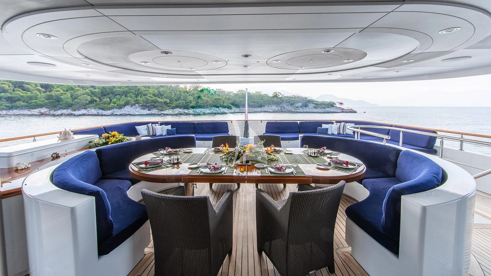 a table with chairs around it aboard RARE FIND Yacht for Charter