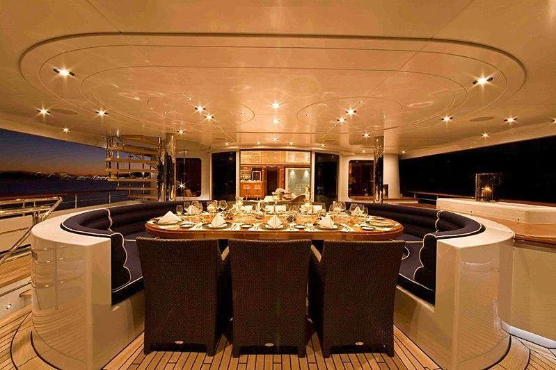 a large room with tables and chairs aboard RARE FIND Yacht for Charter
