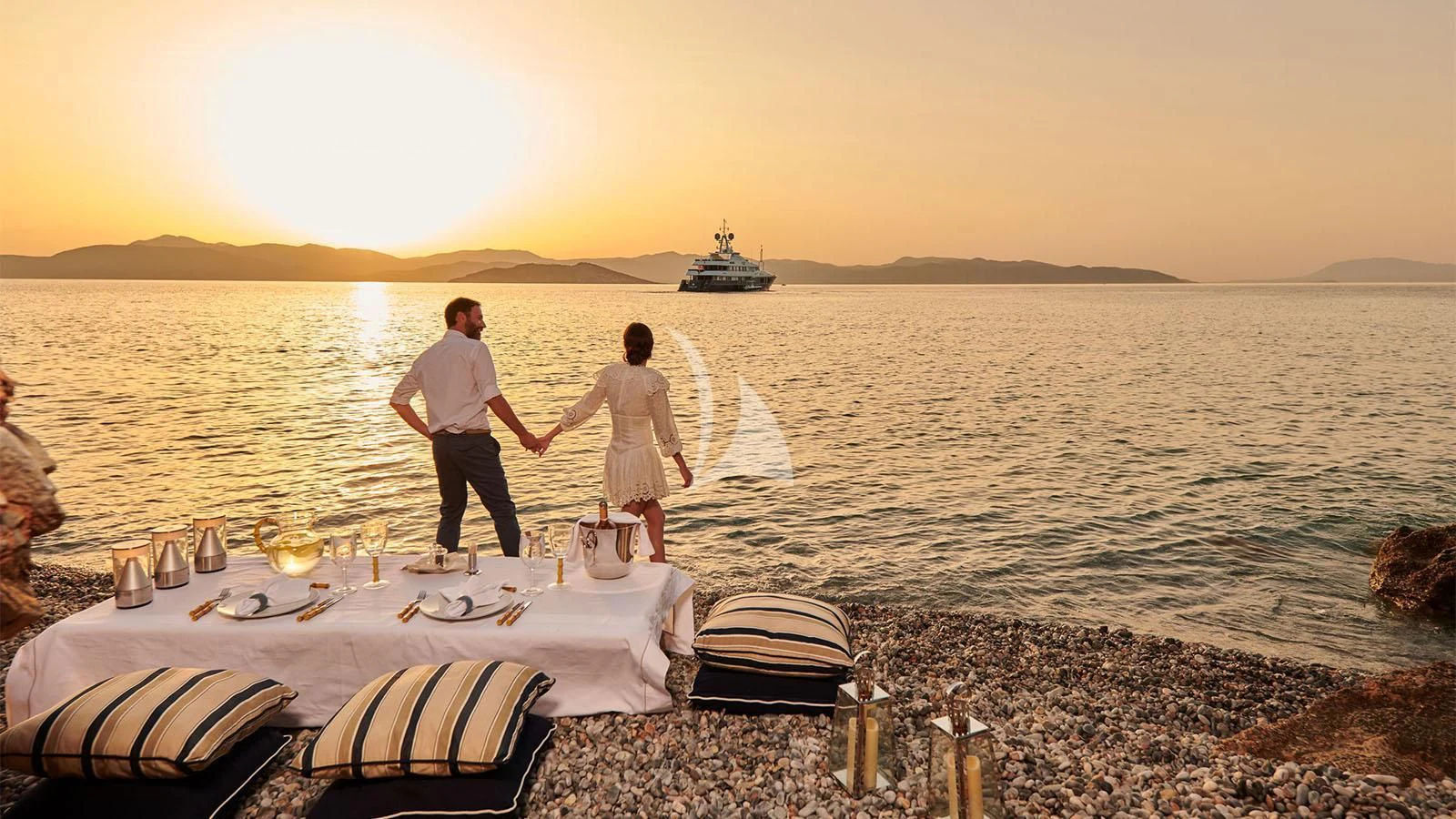 a couple of people standing on a dock by a large body of water aboard RARE FIND Yacht for Charter