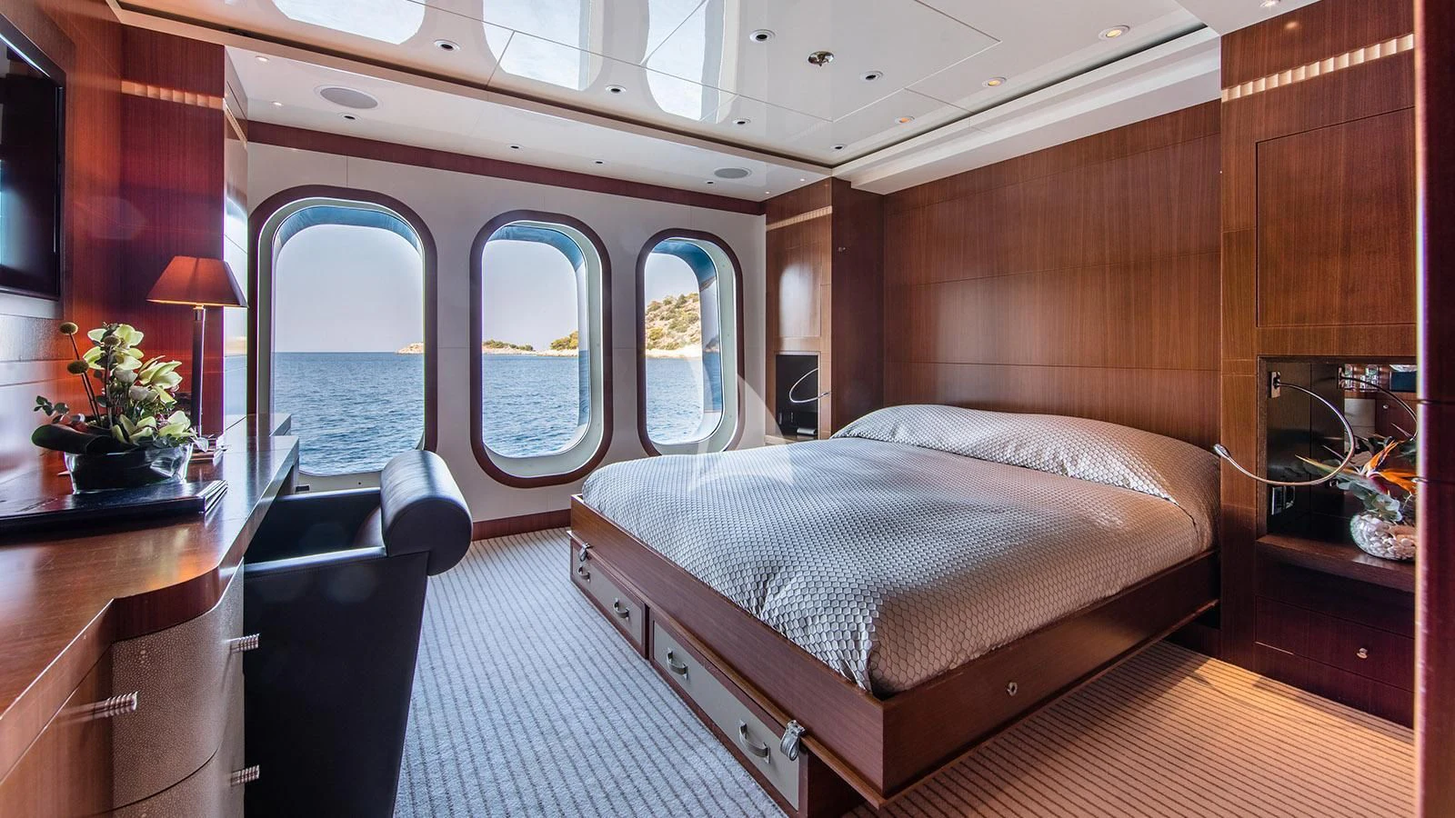 a bedroom with a large bed aboard RARE FIND Yacht for Charter