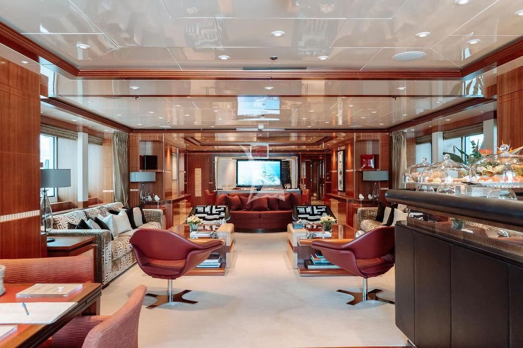 a living room with a large screen aboard RARE FIND Yacht for Charter