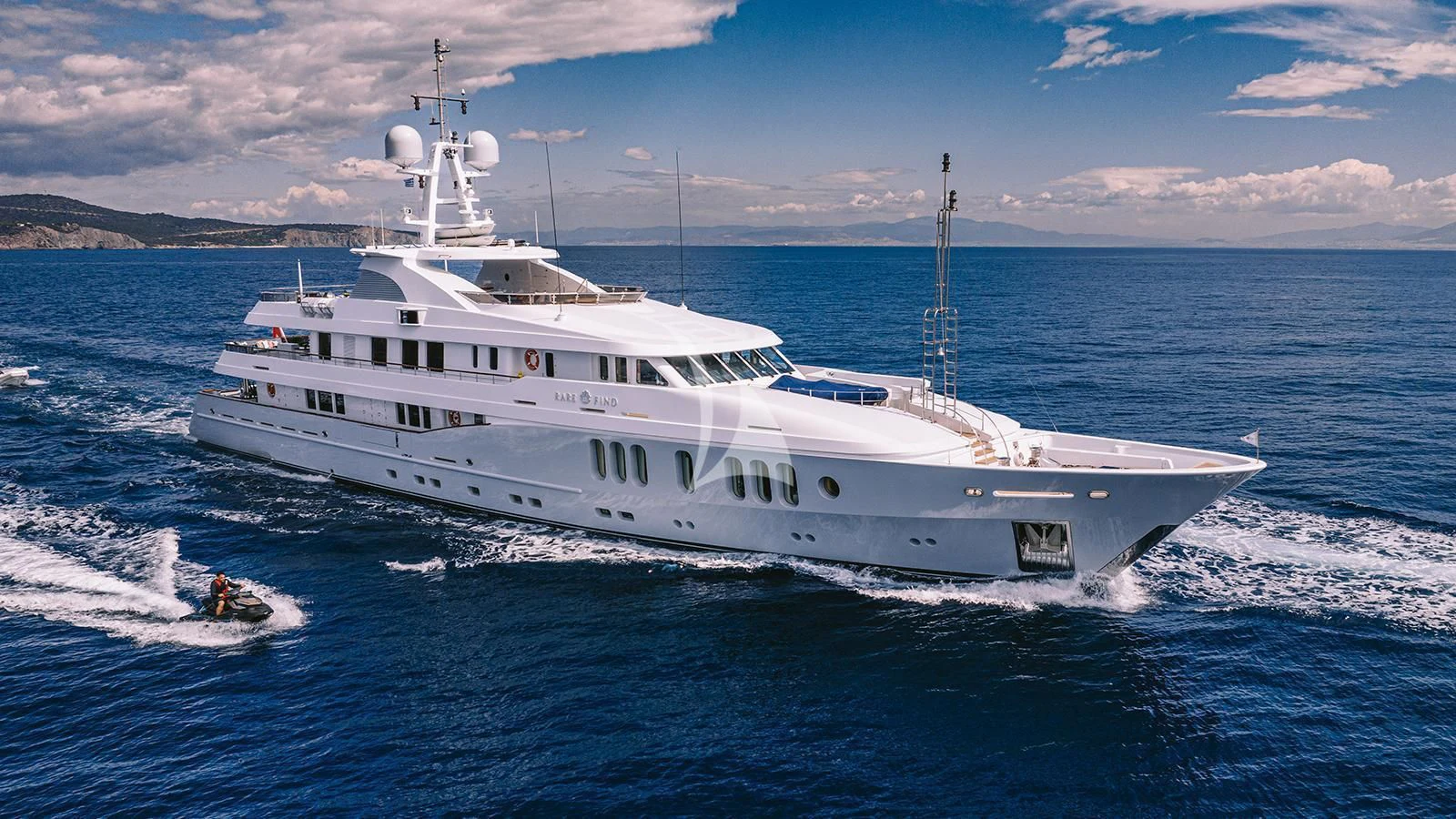 a large white boat aboard RARE FIND Yacht for Charter