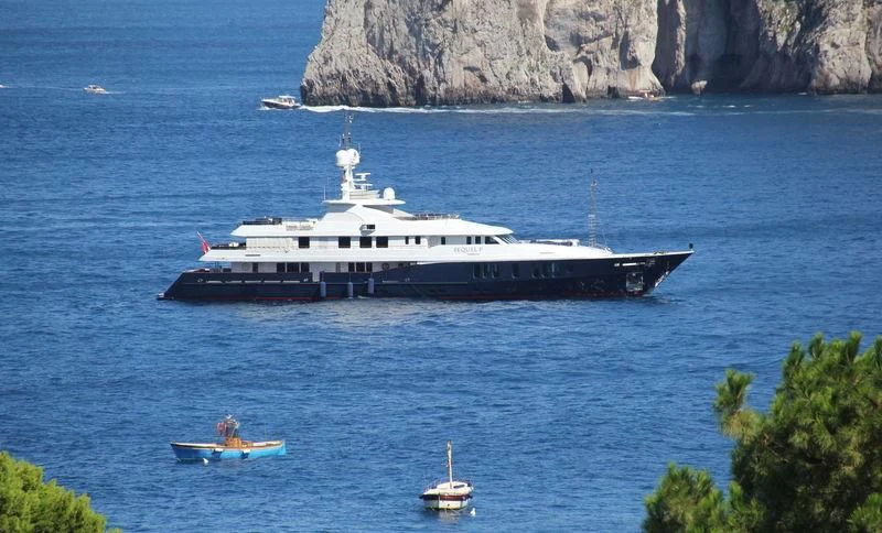 a large ship in the water aboard RARE FIND Yacht for Charter