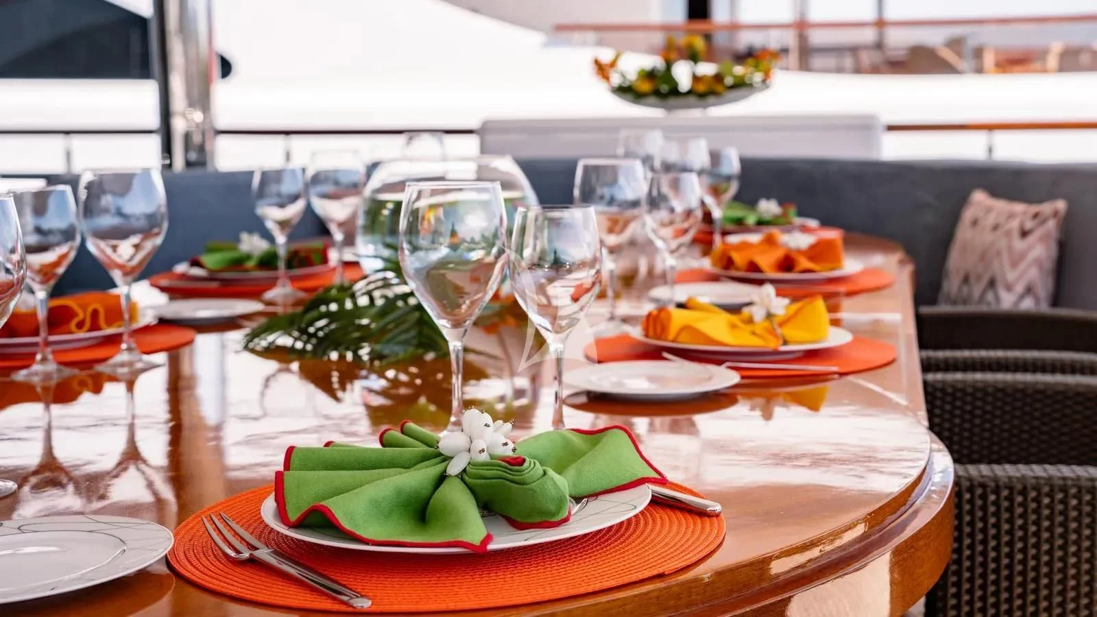 a table with food and wine glasses aboard RARE FIND Yacht for Charter