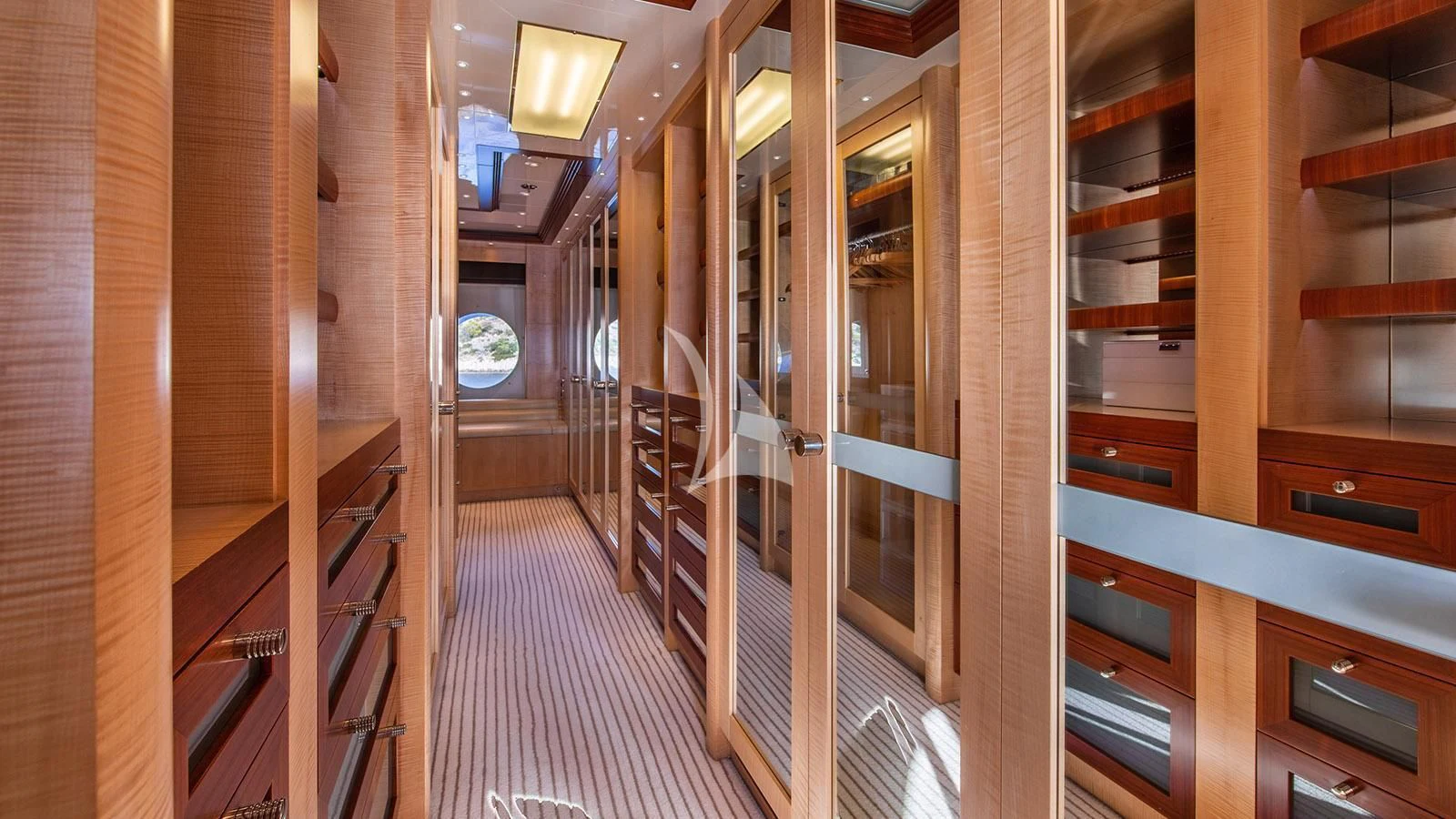 a room with wooden walls and wooden cabinets aboard RARE FIND Yacht for Charter