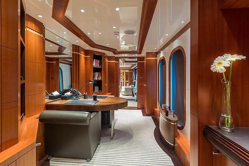 a room with a desk and a chair aboard RARE FIND Yacht for Charter