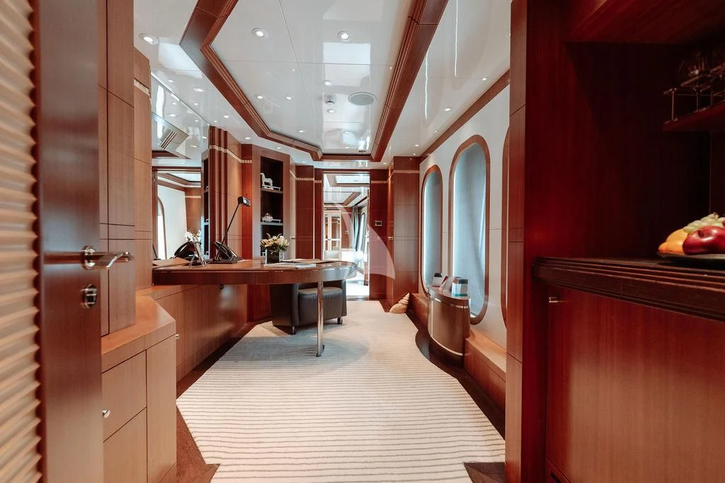 a hallway with red walls aboard RARE FIND Yacht for Charter
