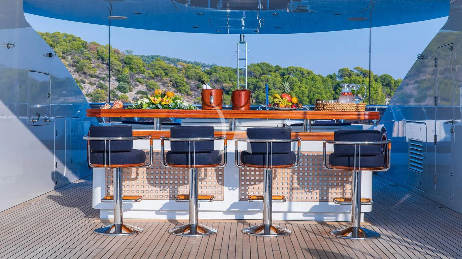 a deck with chairs and tables aboard RARE FIND Yacht for Charter
